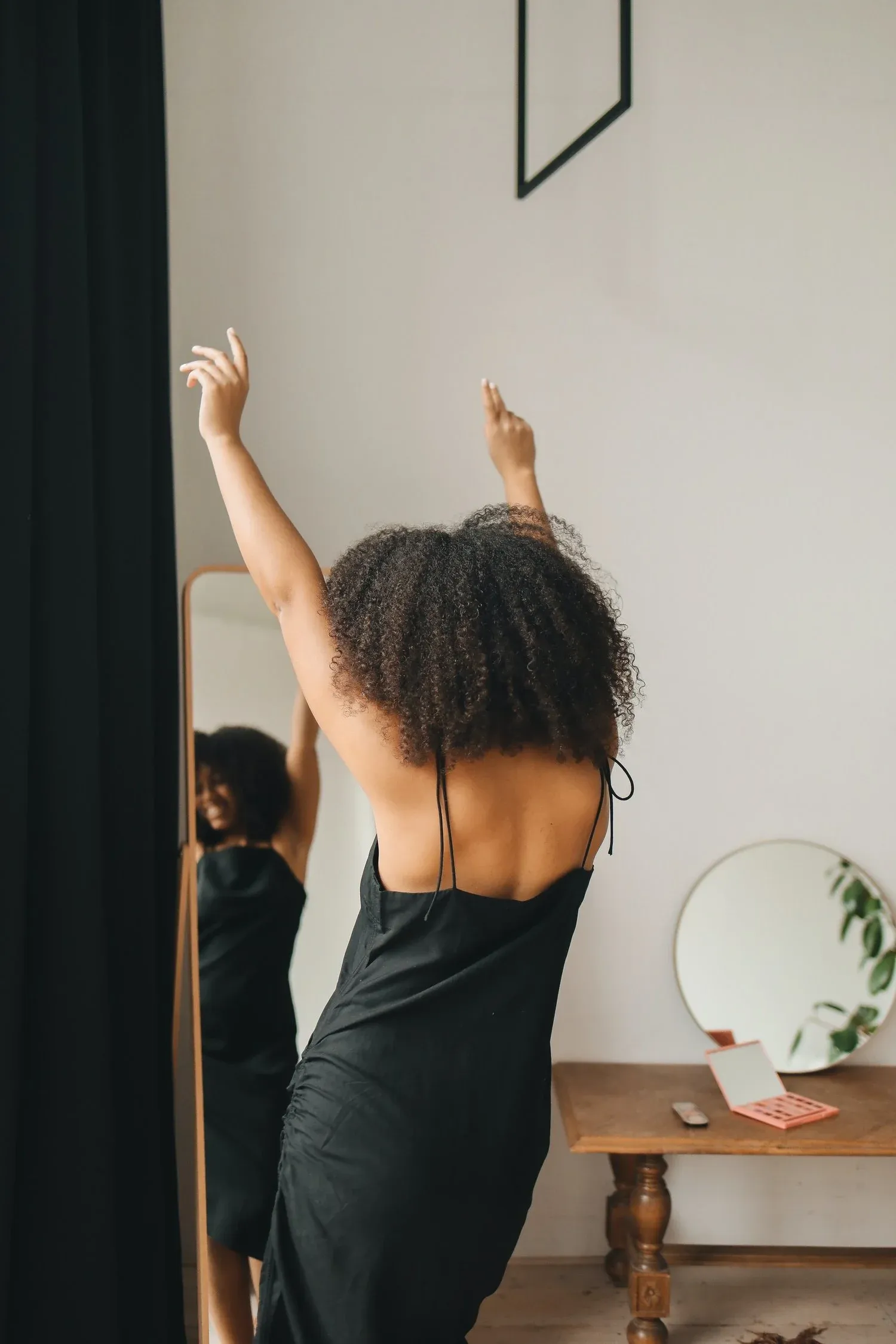 Woman with flowing hair, dancing freely and expressing joy